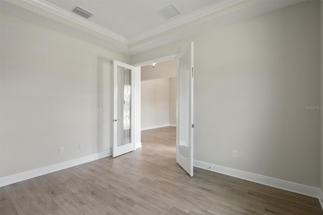 14531 Swiss Bridge Dr, Lithia, FL 33547 - empty room featuring crown molding, wood finished floors, and french doors