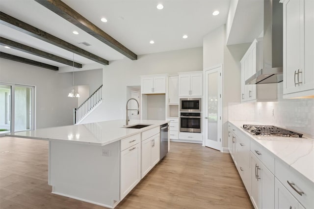 14531 Swiss Bridge Dr, Lithia, FL 33547 - kitchen with stainless steel appliances, decorative backsplash, wall chimney range hood, light wood-type flooring, and beam ceiling