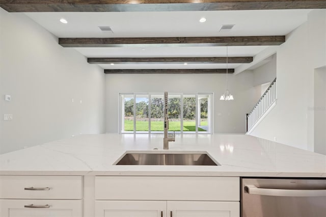 14531 Swiss Bridge Dr, Lithia, FL 33547 - kitchen featuring stainless steel dishwasher, beamed ceiling, light stone countertops, white cabinets, and decorative light fixtures