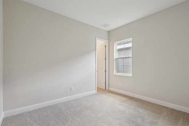 14531 Swiss Bridge Dr, Lithia, FL 33547 - spare room featuring light colored carpet and baseboards
