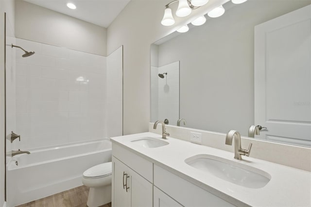14531 Swiss Bridge Dr, Lithia, FL 33547 - full bath featuring double vanity, bathtub / shower combination, wood finished floors, and recessed lighting