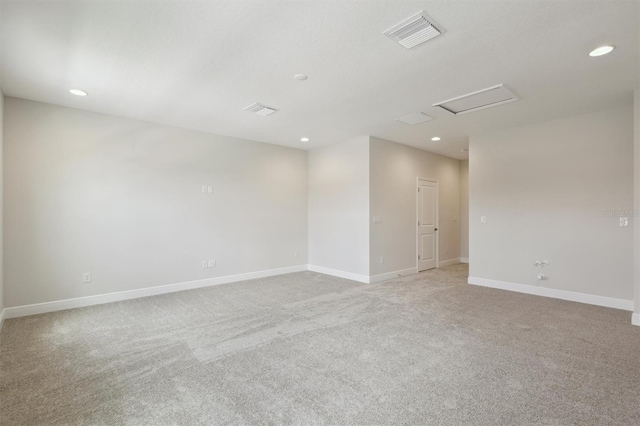 14531 Swiss Bridge Dr, Lithia, FL 33547 - unfurnished room featuring light colored carpet, recessed lighting, and attic access