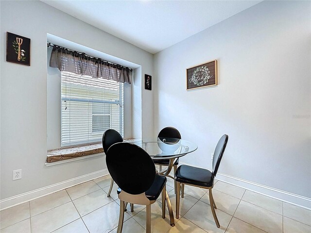 4116 Knollpoint Dr, Wesley Chapel, FL 33544 - dining space with light tile patterned flooring