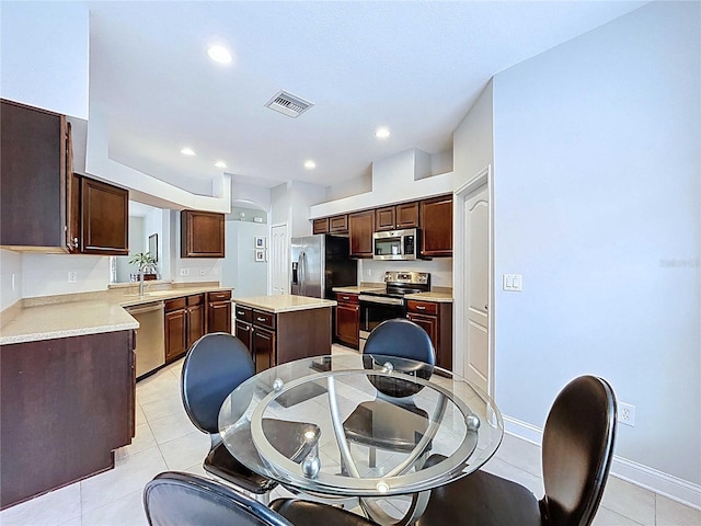 4116 Knollpoint Dr, Wesley Chapel, FL 33544 - dining area featuring light tile patterned floors and recessed lighting