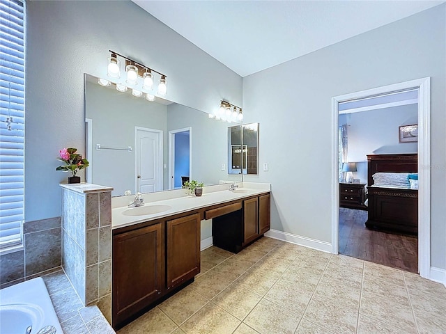 4116 Knollpoint Dr, Wesley Chapel, FL 33544 - ensuite bathroom with double vanity, tile patterned floors, and a bath