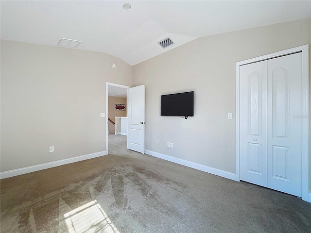 4116 Knollpoint Dr, Wesley Chapel, FL 33544 - unfurnished bedroom with vaulted ceiling, carpet floors, and a closet