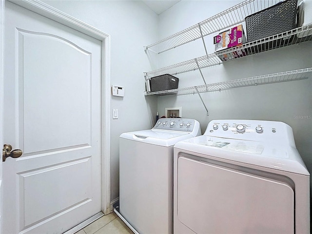 4116 Knollpoint Dr, Wesley Chapel, FL 33544 - washroom featuring washing machine and dryer and light tile patterned flooring