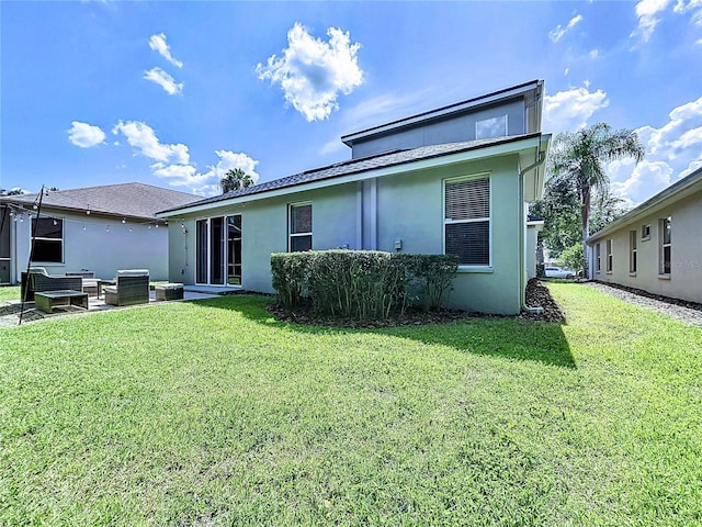 4116 Knollpoint Dr, Wesley Chapel, FL 33544 - back of house with outdoor lounge area, a yard, and stucco siding