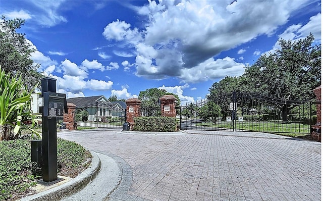 4116 Knollpoint Dr, Wesley Chapel, FL 33544 - view of street with a gate, curbs, and a gated entry
