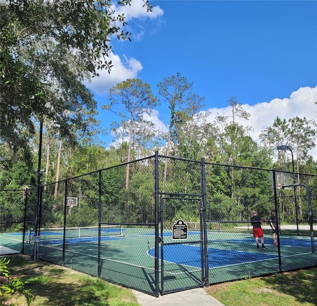 4116 Knollpoint Dr, Wesley Chapel, FL 33544 - view of tennis court featuring a gate and community basketball court