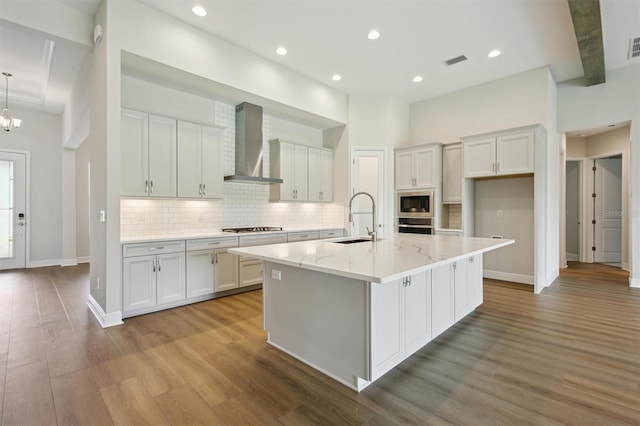 14523 Swiss Bridge Dr, Lithia, FL 33547 - kitchen featuring wall chimney exhaust hood, white cabinets, backsplash, and recessed lighting