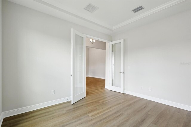 14523 Swiss Bridge Dr, Lithia, FL 33547 - empty room with wood finished floors, a chandelier, and ornamental molding