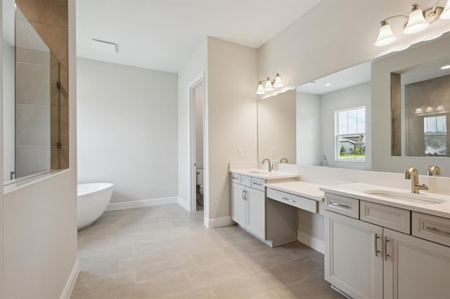 14523 Swiss Bridge Dr, Lithia, FL 33547 - bathroom featuring double vanity, a freestanding bath, a tile shower, and tile patterned flooring