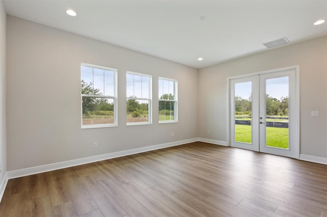 14523 Swiss Bridge Dr, Lithia, FL 33547 - unfurnished room with french doors, wood finished floors, and recessed lighting