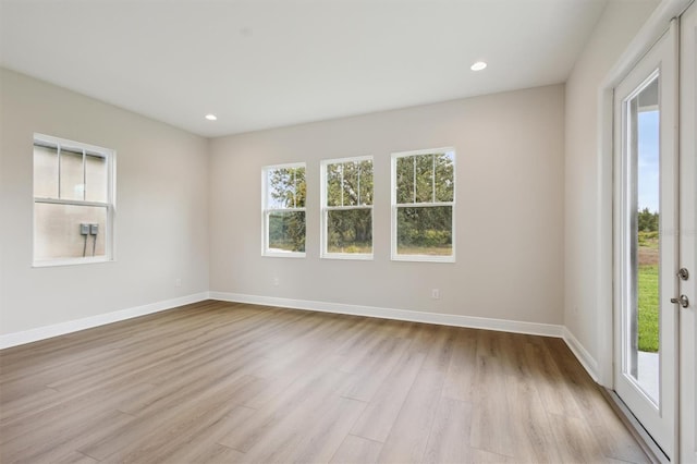 14523 Swiss Bridge Dr, Lithia, FL 33547 - spare room featuring light wood-type flooring and recessed lighting