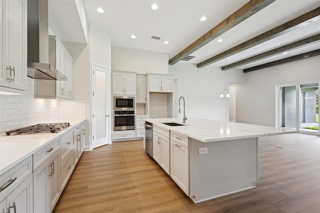 14523 Swiss Bridge Dr, Lithia, FL 33547 - kitchen with stainless steel appliances, wall chimney exhaust hood, decorative backsplash, light stone counters, and recessed lighting
