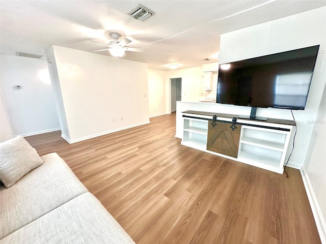 121 Granada Blvd, North Port, FL 34287 - unfurnished living room with light wood-style flooring and a ceiling fan