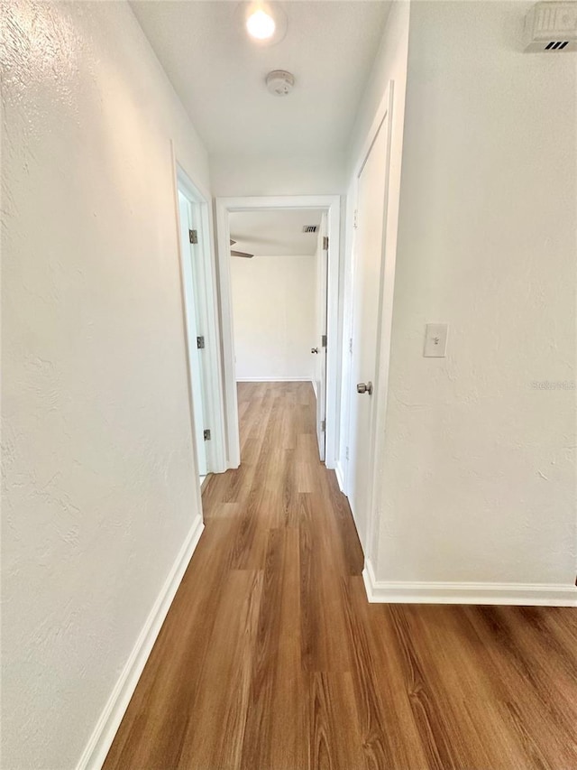 121 Granada Blvd, North Port, FL 34287 - hall with wood finished floors and baseboards