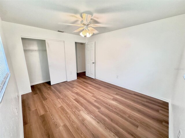 121 Granada Blvd, North Port, FL 34287 - unfurnished bedroom featuring light wood-style floors, a closet, and ceiling fan
