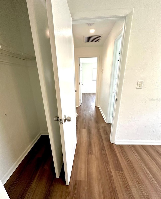 121 Granada Blvd, North Port, FL 34287 - hallway with wood finished floors and baseboards