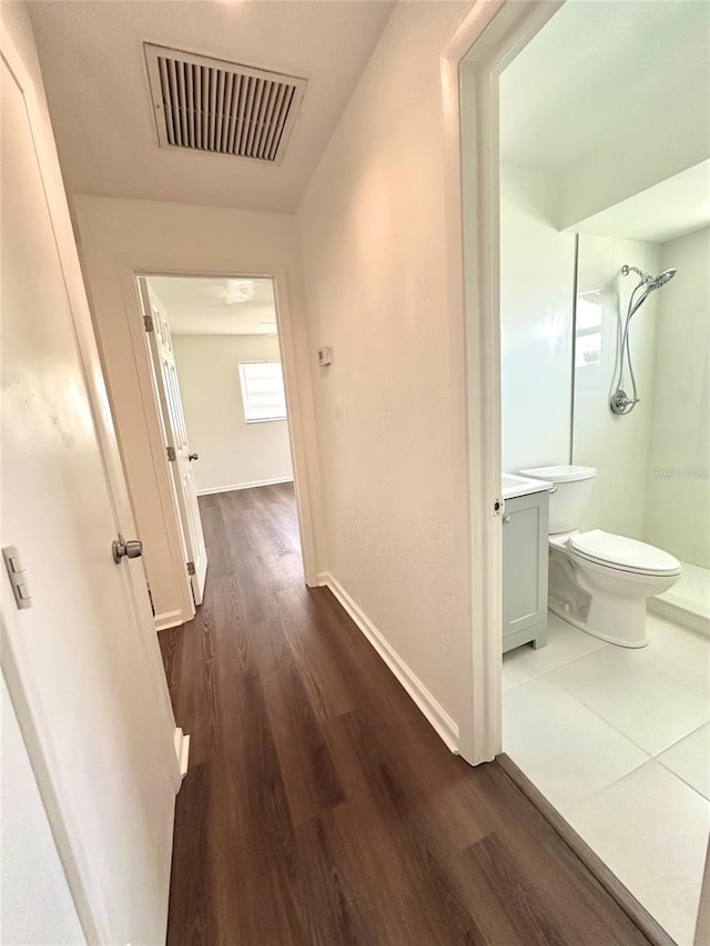 121 Granada Blvd, North Port, FL 34287 - corridor with dark wood finished floors and baseboards