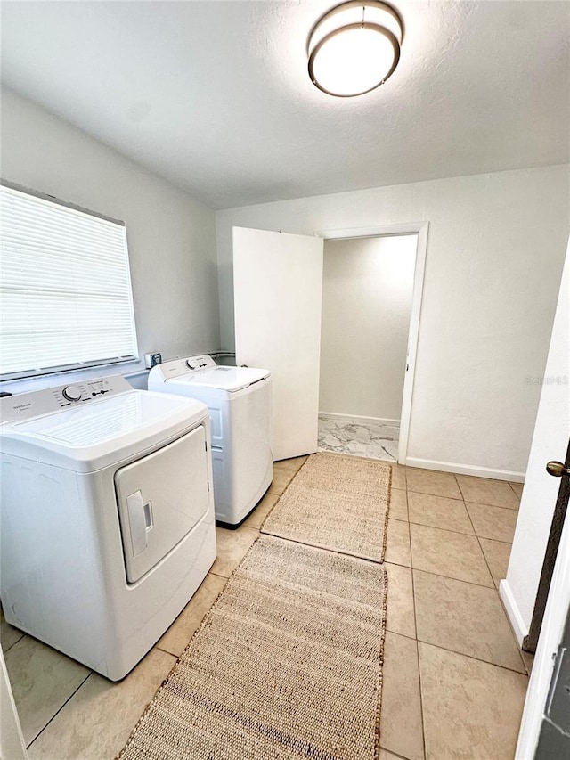 121 Granada Blvd, North Port, FL 34287 - washroom featuring independent washer and dryer and light tile patterned floors