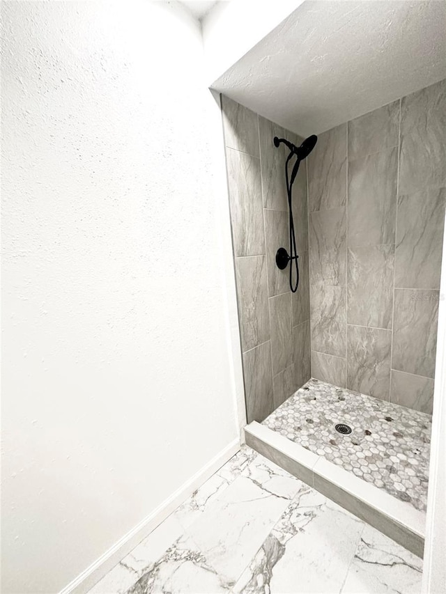 121 Granada Blvd, North Port, FL 34287 - full bath with marble look tile flooring and a shower stall