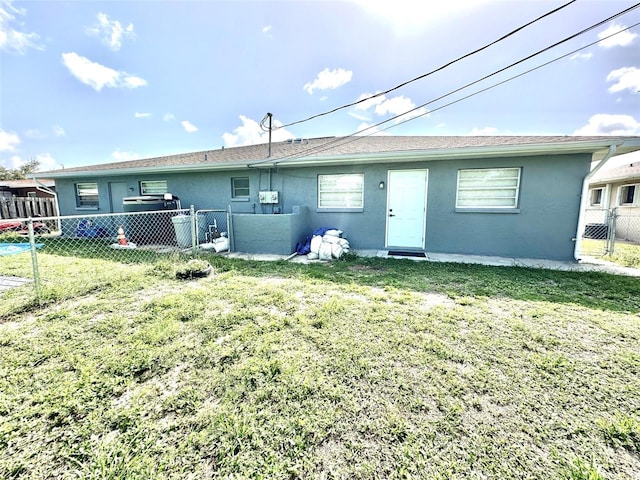 121 Granada Blvd, North Port, FL 34287 - rear view of property featuring stucco siding and a fenced backyard