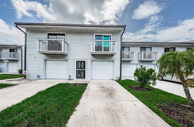 6206 92nd Pl N Unit 3605, Pinellas Park, FL 33782 - view of front facade with a garage and driveway