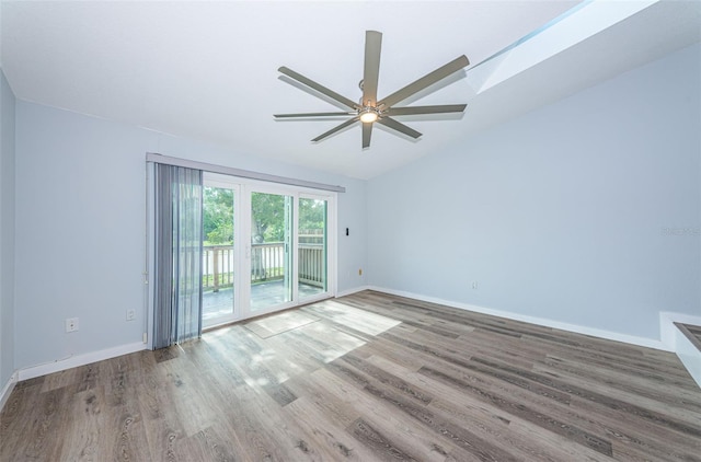 6206 92nd Pl N Unit 3605, Pinellas Park, FL 33782 - spare room featuring ceiling fan, wood finished floors, and vaulted ceiling
