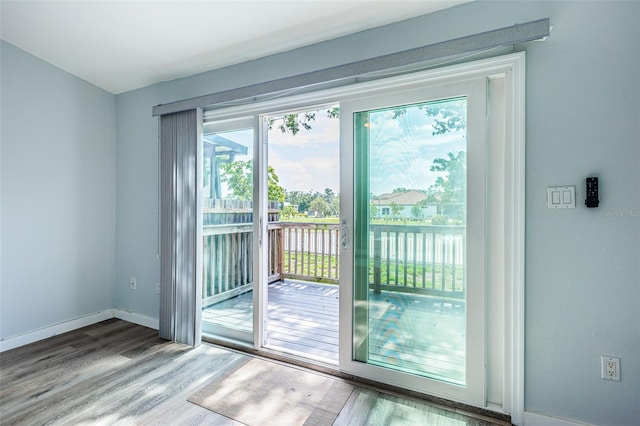 6206 92nd Pl N Unit 3605, Pinellas Park, FL 33782 - doorway to outside featuring wood finished floors and a water view