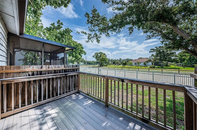 6206 92nd Pl N Unit 3605, Pinellas Park, FL 33782 - wooden terrace featuring a sunroom and a fenced backyard