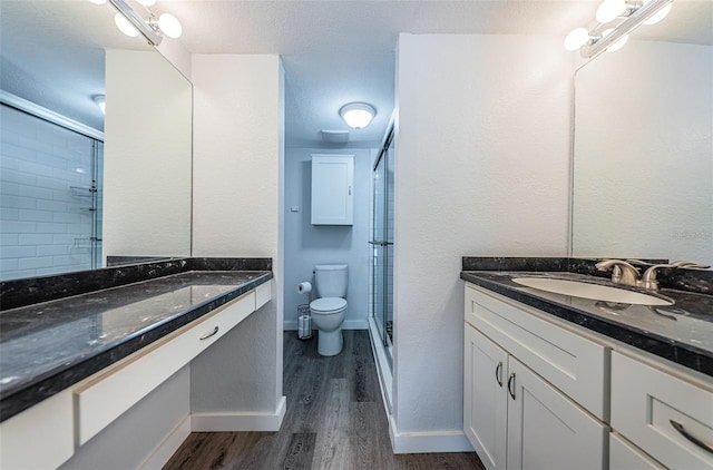 6206 92nd Pl N Unit 3605, Pinellas Park, FL 33782 - full bath featuring a shower stall, vanity, and wood finished floors