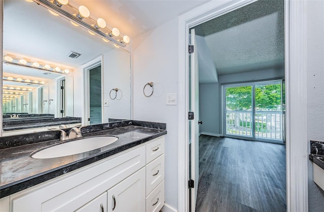 6206 92nd Pl N Unit 3605, Pinellas Park, FL 33782 - bathroom with vanity and wood finished floors