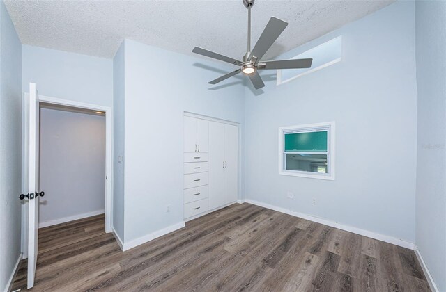 6206 92nd Pl N Unit 3605, Pinellas Park, FL 33782 - unfurnished bedroom with wood finished floors, a textured ceiling, a closet, and ceiling fan