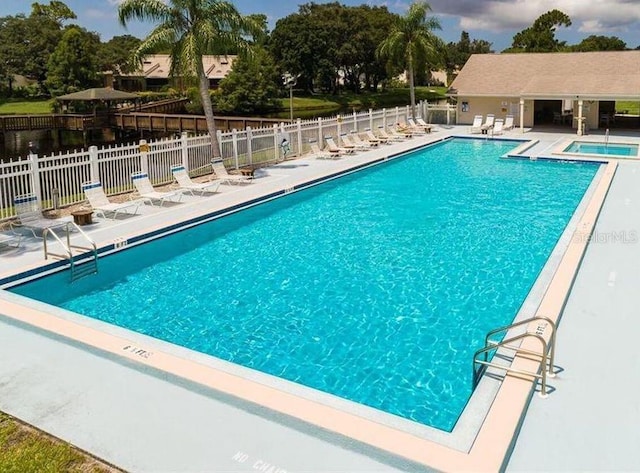6206 92nd Pl N Unit 3605, Pinellas Park, FL 33782 - community pool featuring a hot tub and a patio