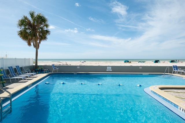9980 Gulf Blvd Unit 408, Treasure Island, FL 33706 - community pool featuring a water view and a patio