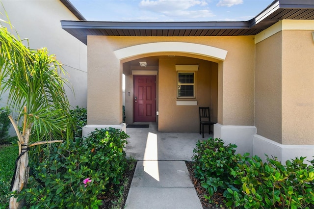 9437 Lemon Drop Loop, Sun City Center, FL 33573 - property entrance with stucco siding