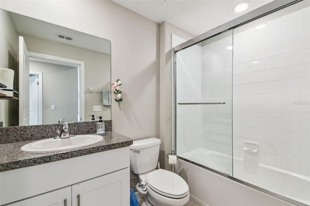9437 Lemon Drop Loop, Sun City Center, FL 33573 - bathroom featuring vanity and shower / bath combination with glass door