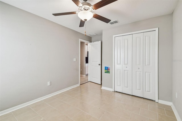 9437 Lemon Drop Loop, Sun City Center, FL 33573 - unfurnished bedroom with a closet and ceiling fan