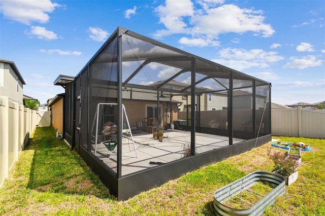 9437 Lemon Drop Loop, Sun City Center, FL 33573 - rear view of property with a fenced backyard, a patio, and a lanai