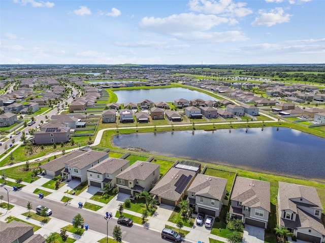 9437 Lemon Drop Loop, Sun City Center, FL 33573 - aerial view of residential area with a large body of water