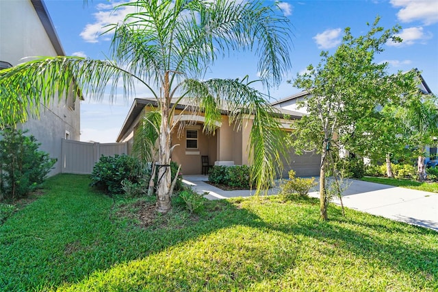 9437 Lemon Drop Loop, Sun City Center, FL 33573 - view of front of house featuring stucco siding, a garage, and driveway