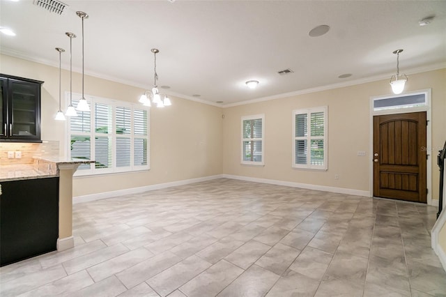 9349 Mira Valle Ln, Winter Garden, FL 34787 - kitchen with ornamental molding, dark cabinets, decorative light fixtures, glass insert cabinets, and light stone countertops