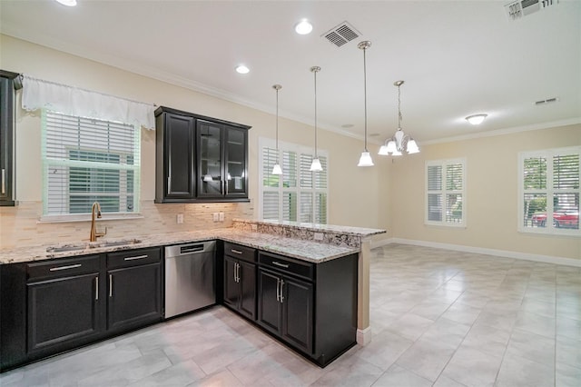 9349 Mira Valle Ln, Winter Garden, FL 34787 - kitchen featuring dishwasher, dark cabinets, tasteful backsplash, a peninsula, and ornamental molding