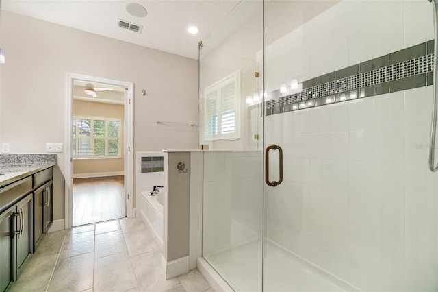 9349 Mira Valle Ln, Winter Garden, FL 34787 - bathroom with a shower stall, a garden tub, vanity, ceiling fan, and recessed lighting