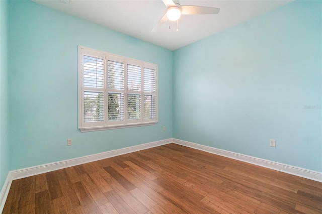 9349 Mira Valle Ln, Winter Garden, FL 34787 - unfurnished room with dark wood-type flooring and a ceiling fan