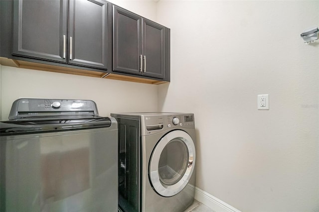 9349 Mira Valle Ln, Winter Garden, FL 34787 - laundry room featuring washing machine and dryer and cabinet space