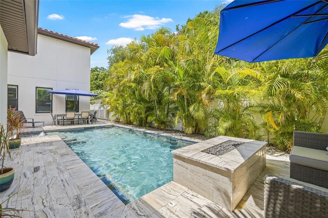 311 12th Ave N, Saint Petersburg, FL 33701 - outdoor pool featuring outdoor dining space, a patio, and a fenced backyard