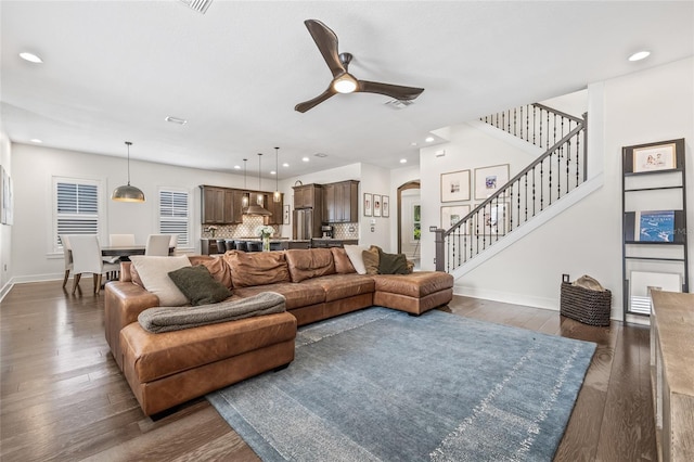 311 12th Ave N, Saint Petersburg, FL 33701 - living room with arched walkways, a ceiling fan, dark wood-style flooring, stairs, and recessed lighting